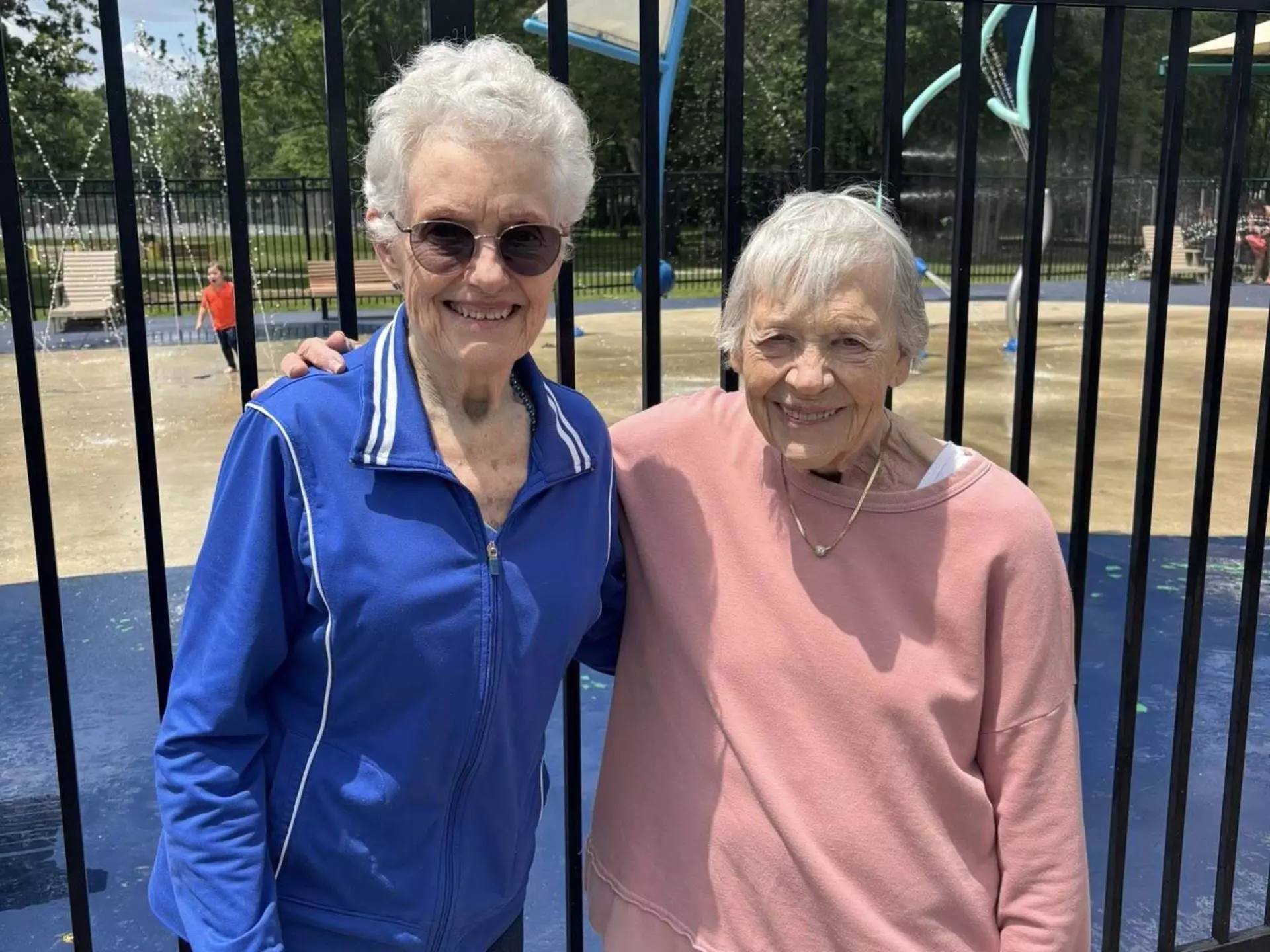 Two happy StoryPoint Group residents are enjoying a local park.