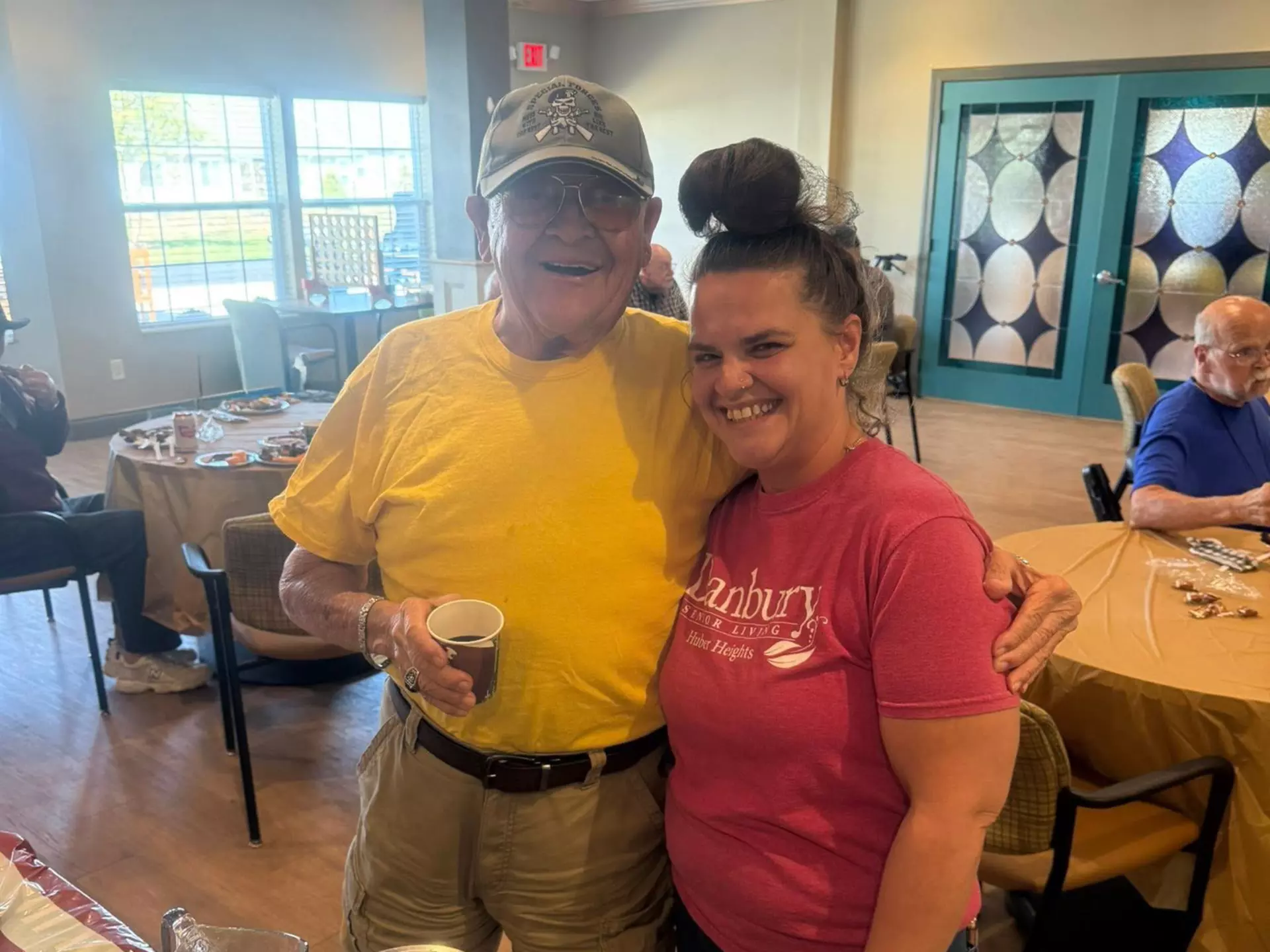 Danbury Huber Heights resident and staff member are enjoying a lively event.