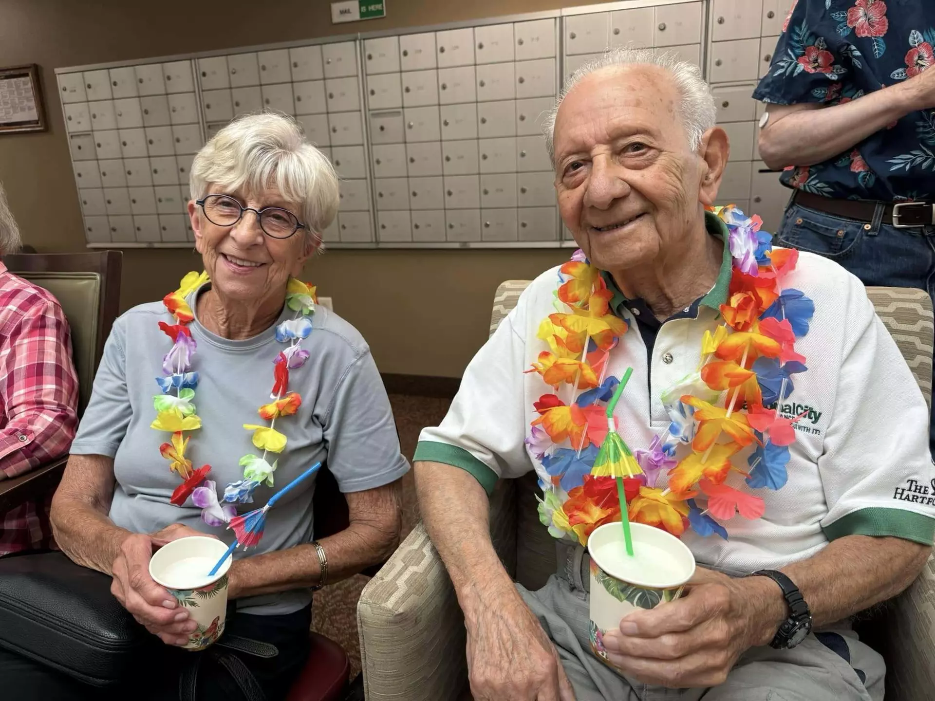Two StoryPoint Group residents are enjoying a Luau party. 